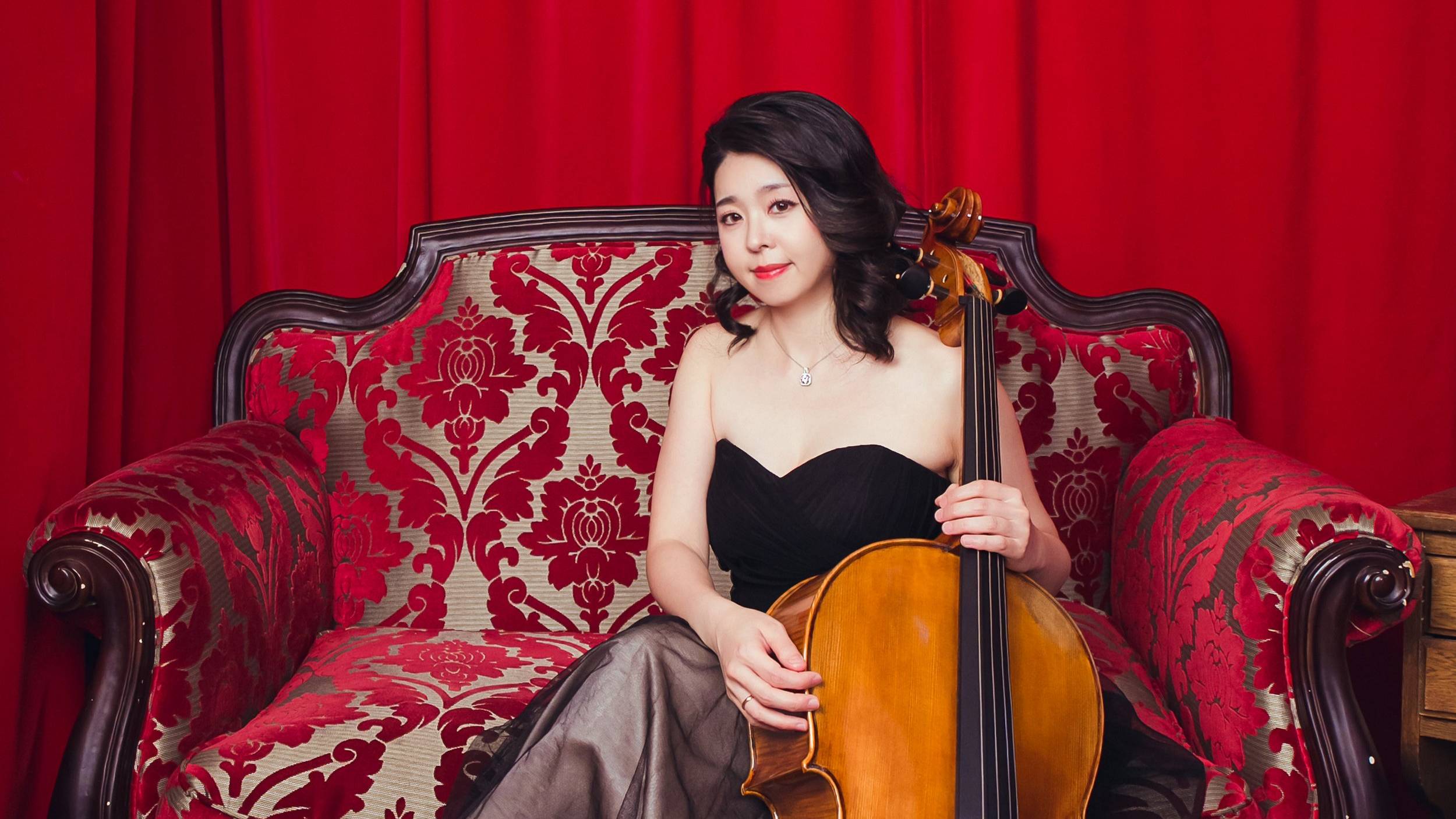 Dr. Kaye Chang Chilton portrait with cello