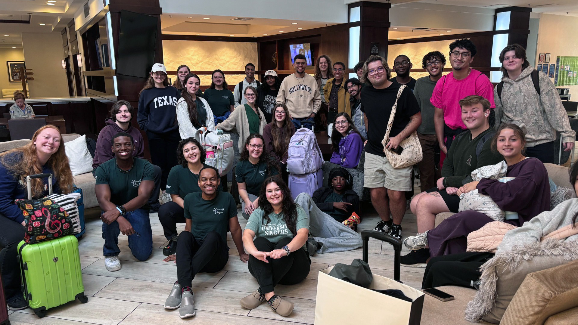 University Singers posing pre-departure at the airport