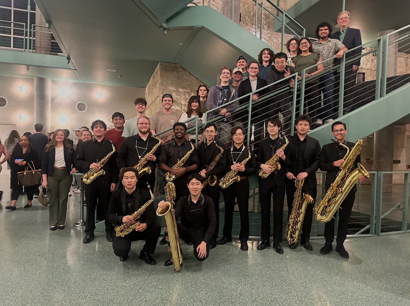 The UNT Saxophone Studio poses for a photo after a wind studies concert in the murchison. 