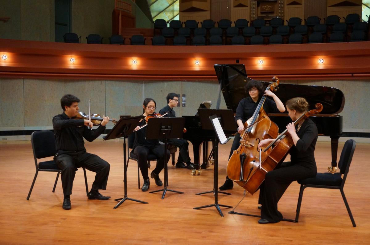 Students performing on stage