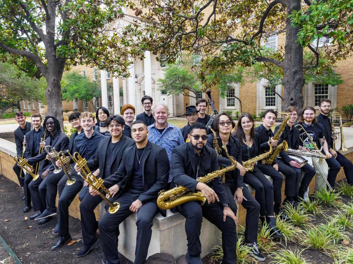 Group from band in front of diving eagle statue