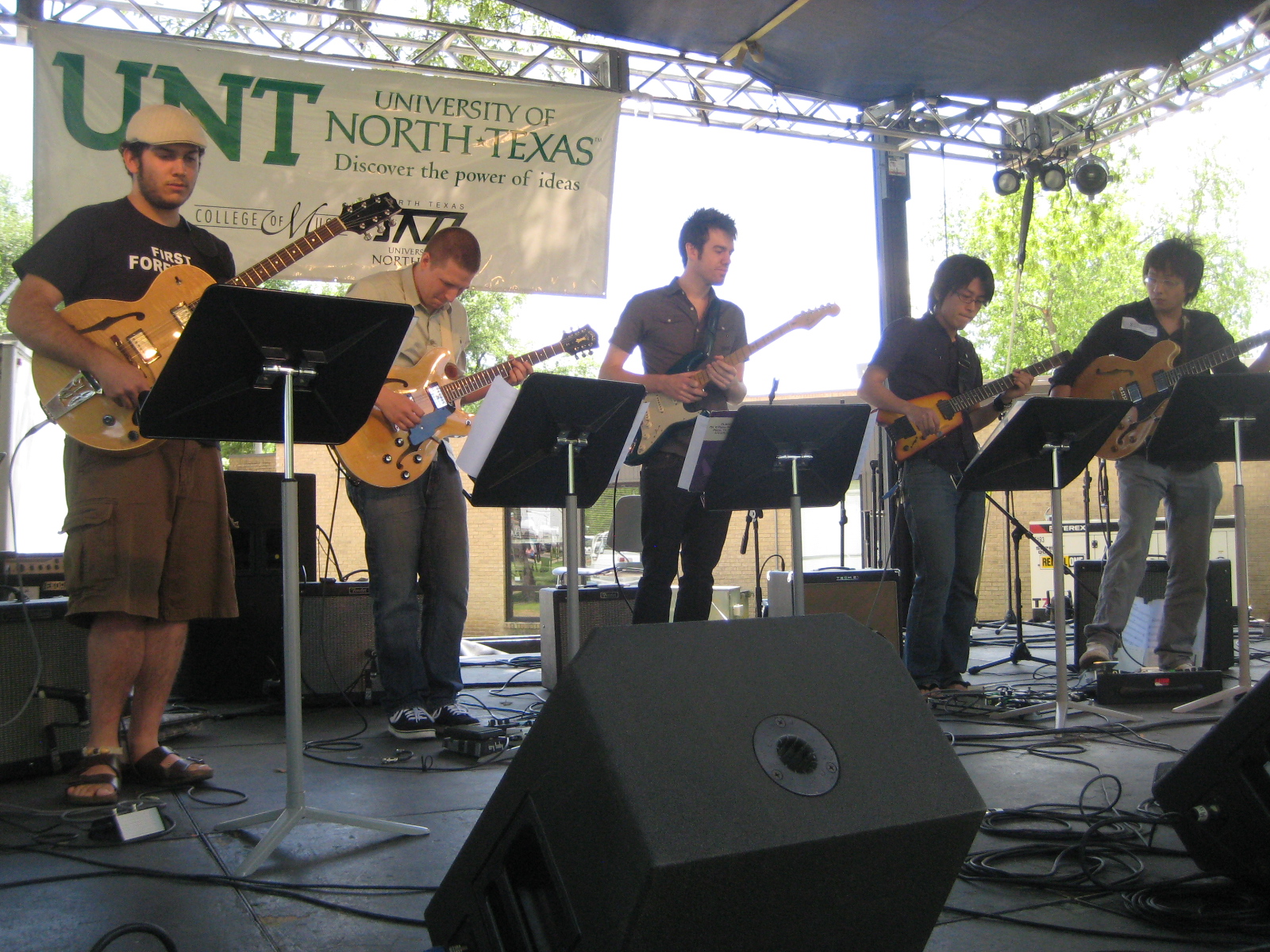 Five guitar students on stage at Denton Arts & Jazzfest