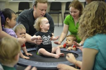 Instructor interacting with little child in UNT Early Childhood music program