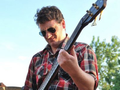 Andy Greatorex performing on guitar