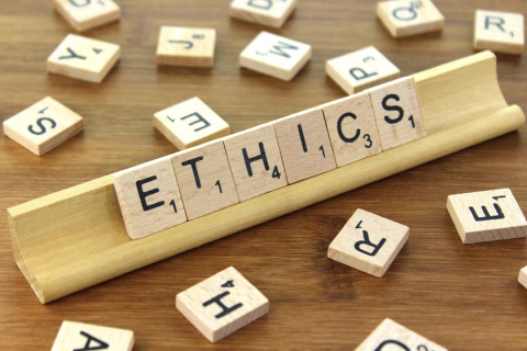 Scrabble Tiles spelling "Ethics"