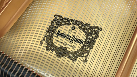 Inside of Yamaha Piano with Yamaha Logo