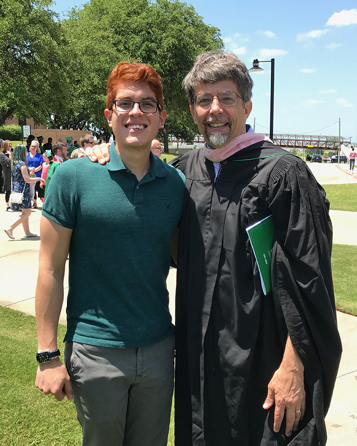 Alumni Aaron Olguin posing with Professor Bradetich